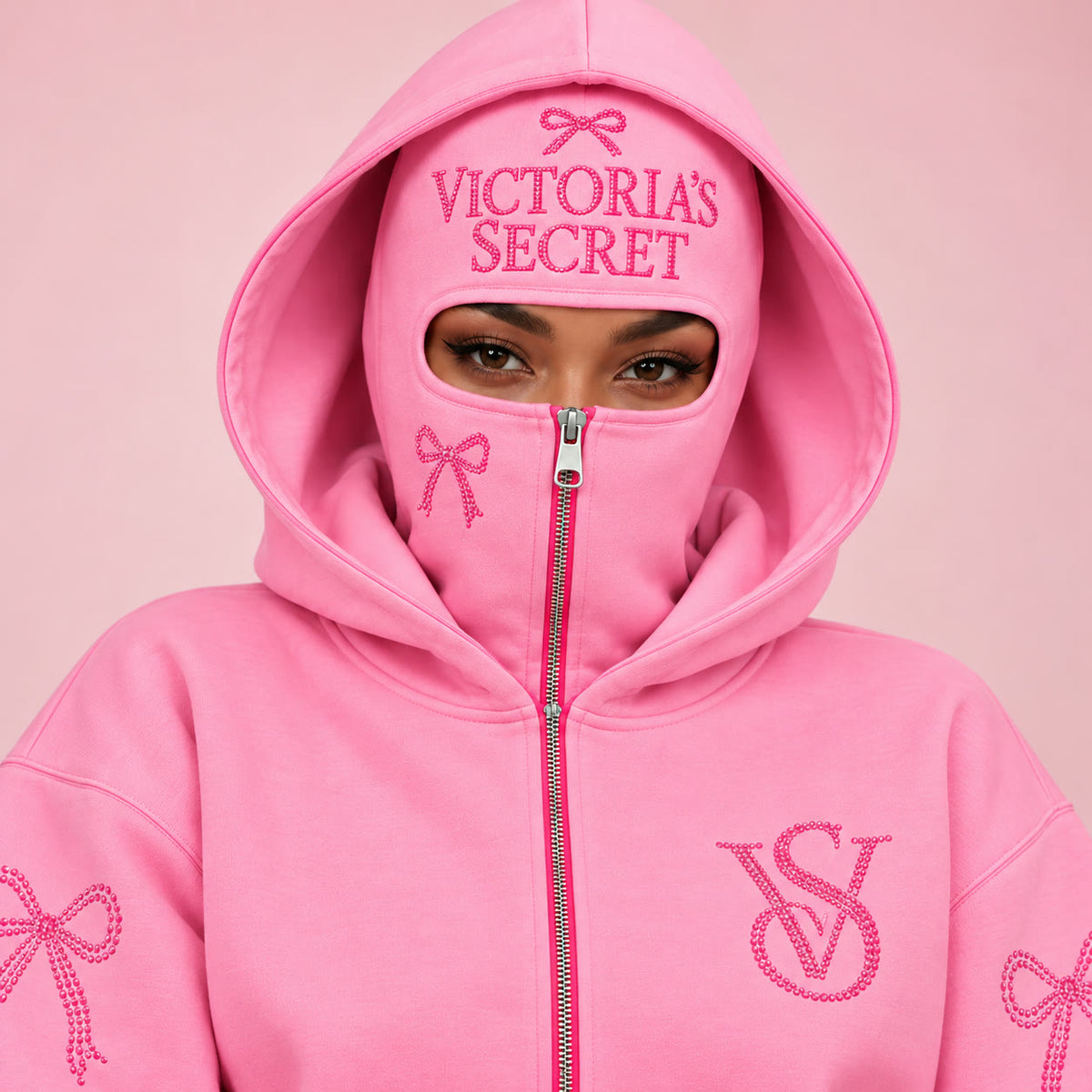 VS Balaclava Zip Hoodie in Light Pink, zipped to the eyes with rhinestone VICTORIA'S SECRET across the mask