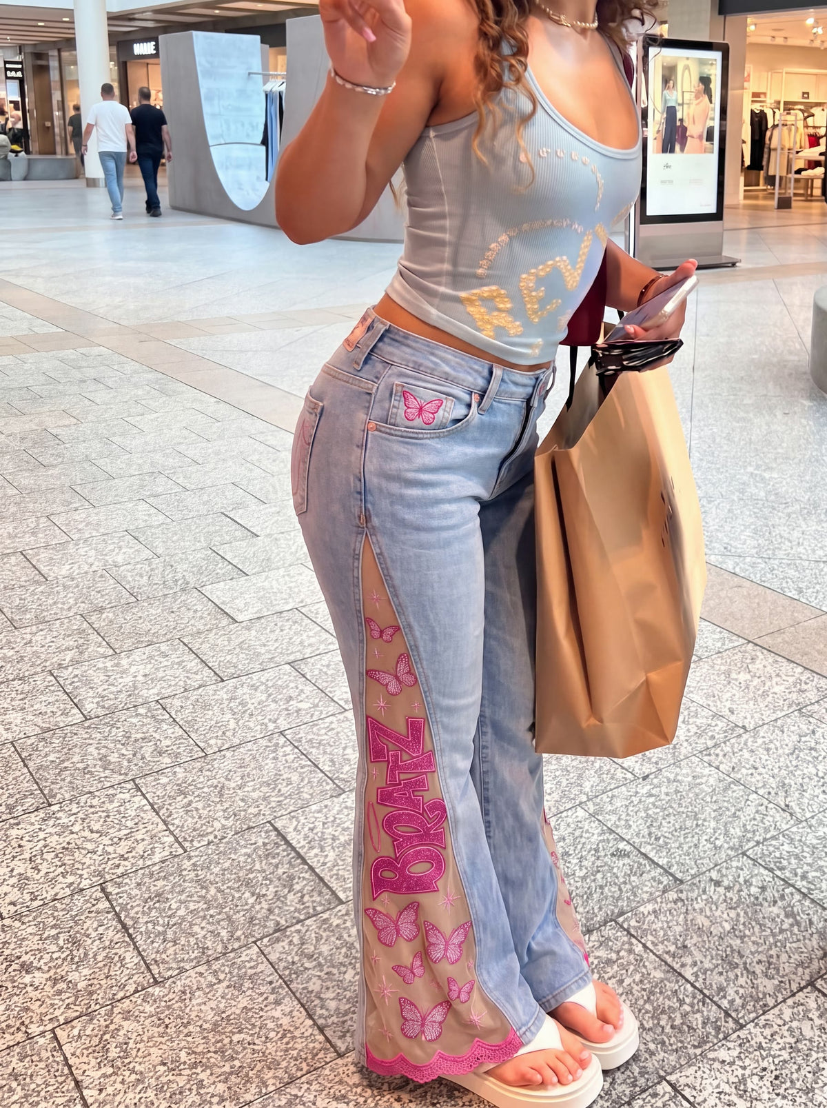 PINK FLARE jeans worn, customer-style photo